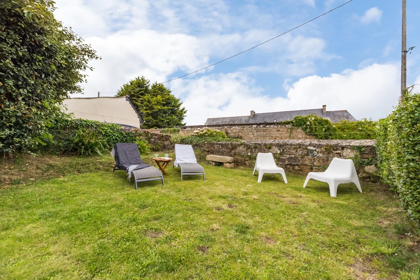 Enclosed garden with sun loungers